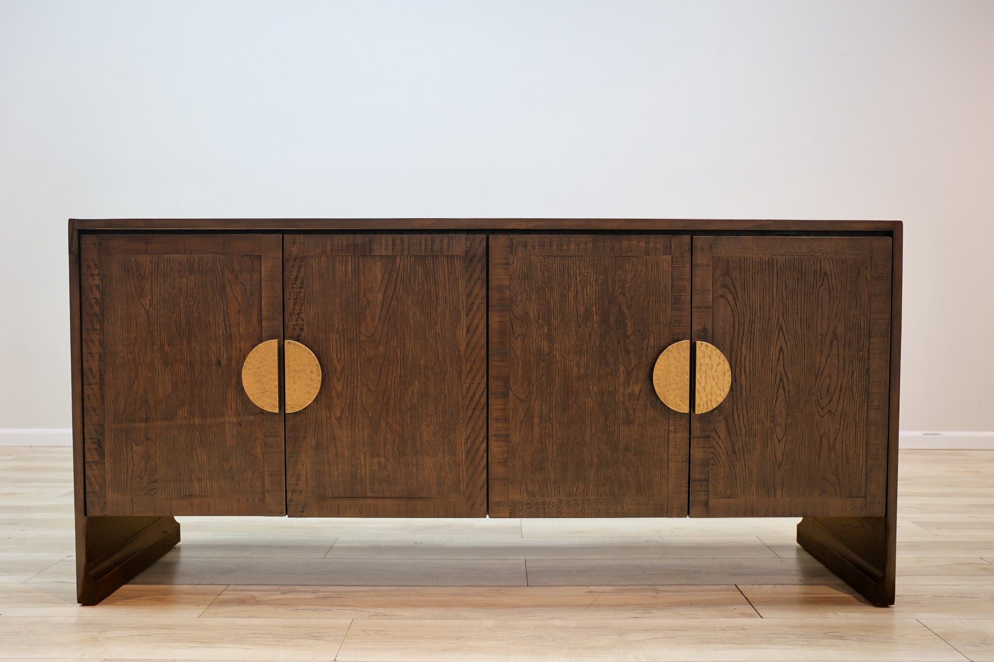 Jorge credenza in solid Mexican pine with four doors and split hammered-gold circle pulls, living room