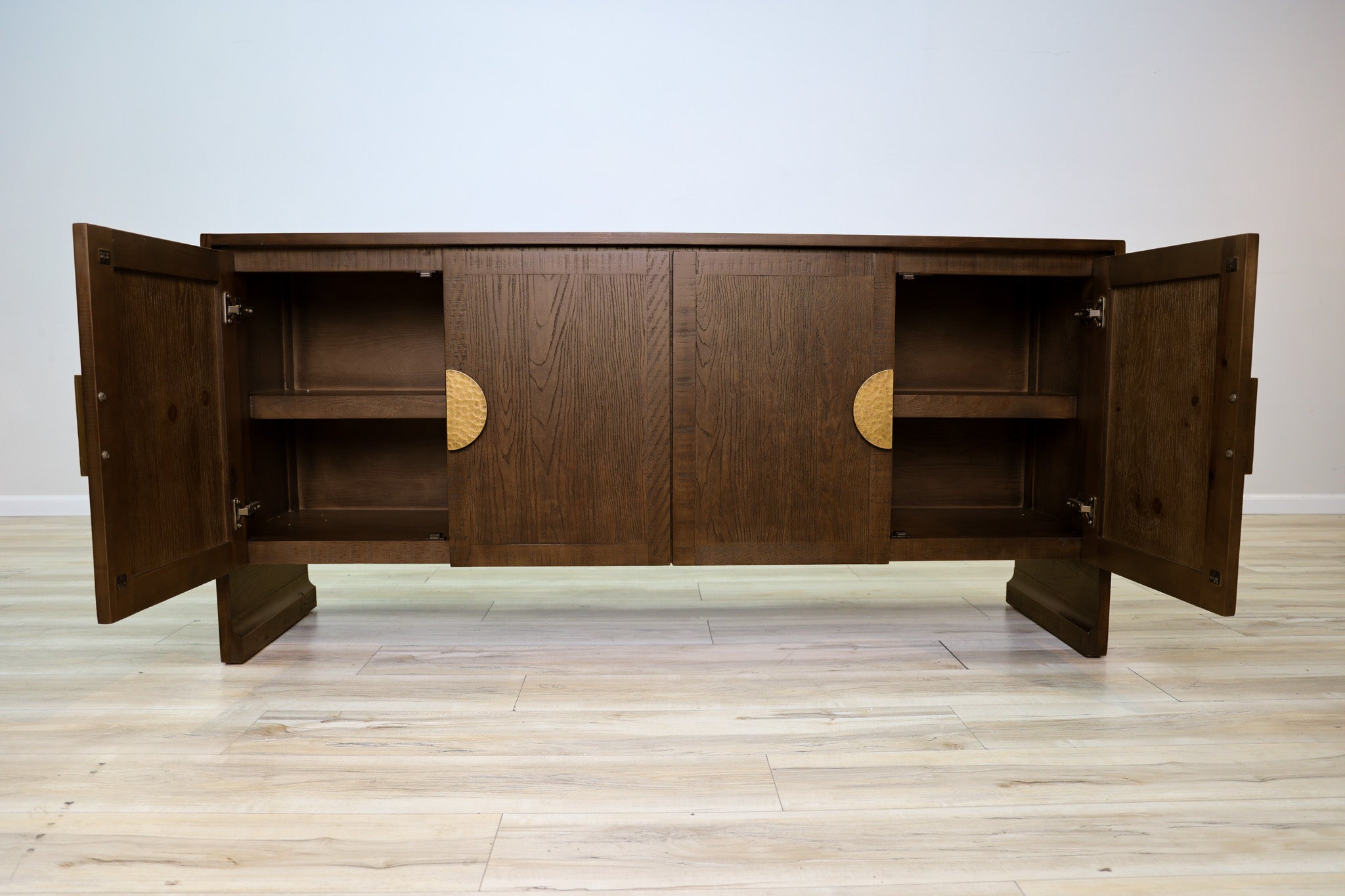 Jorge credenza in solid Mexican pine with four doors and split hammered-gold circle pulls, living room