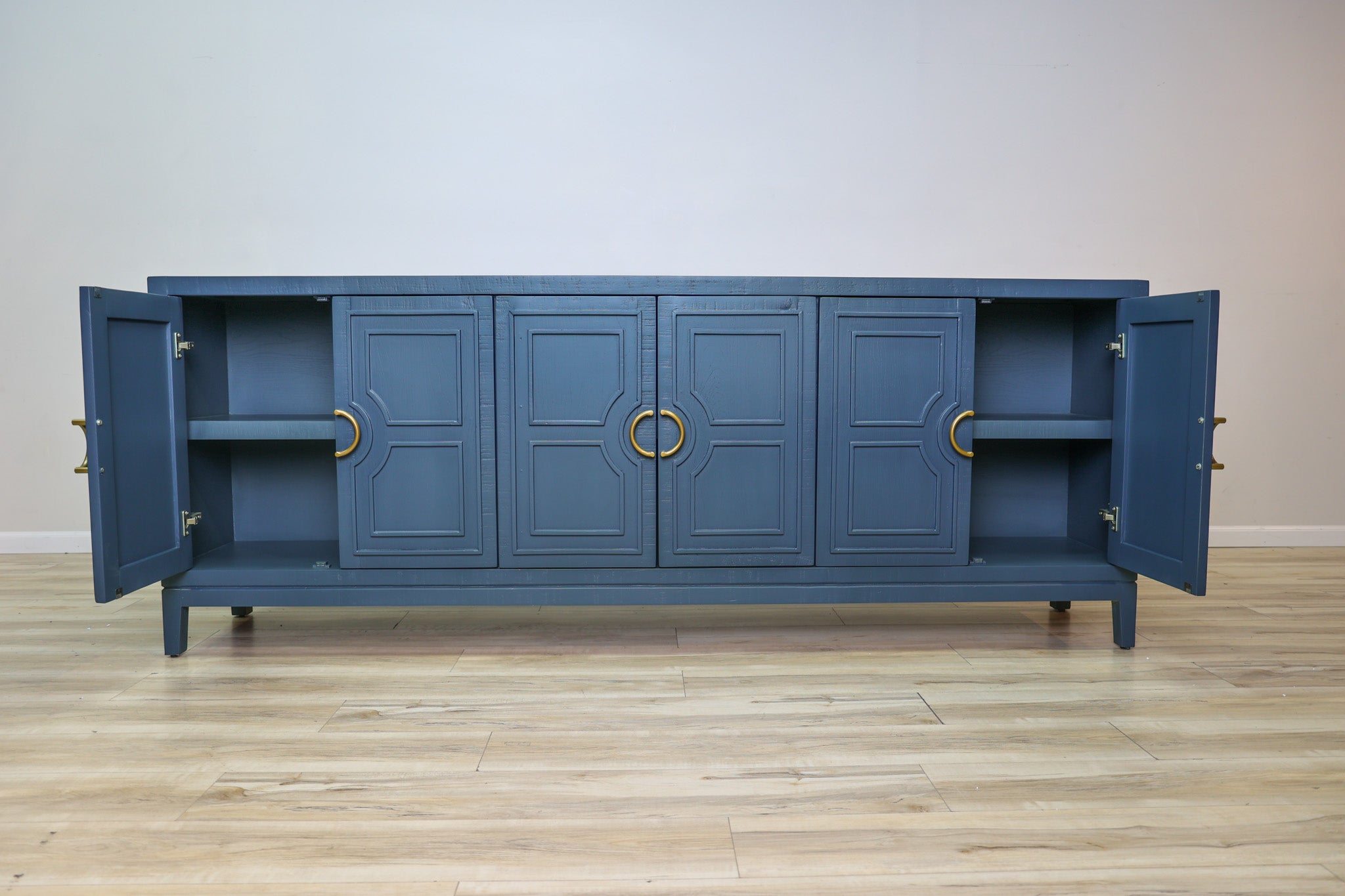 David 90-inch blue credenza in solid Mexican pine with six geometric panel doors and gold ring pulls, living room