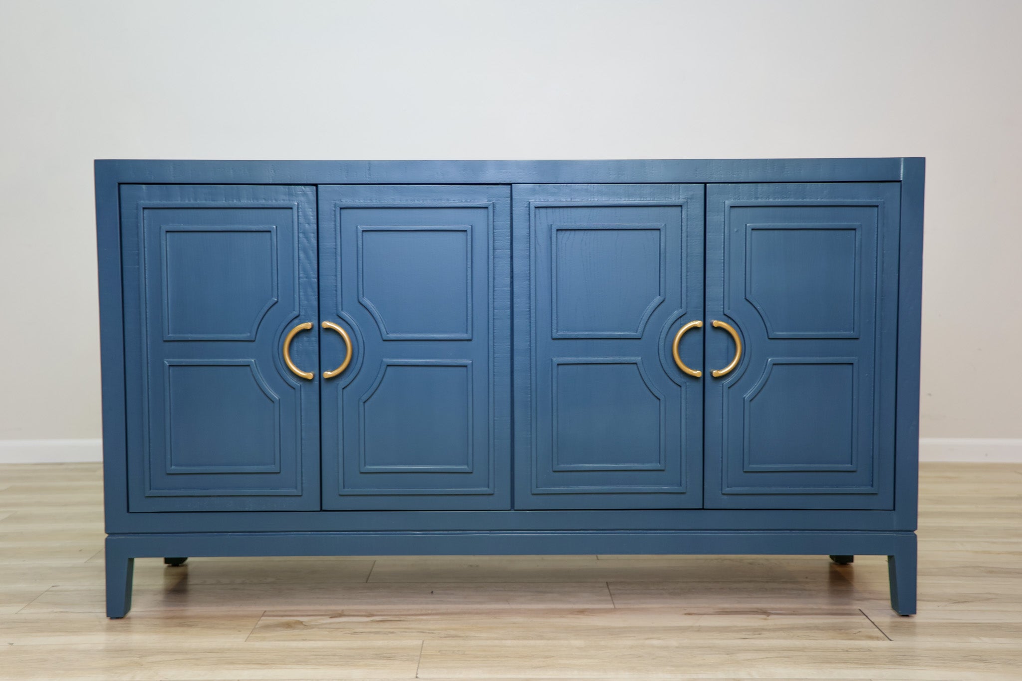 David 64-inch blue credenza in solid Mexican pine with four geometric panel doors and gold ring pulls, living room