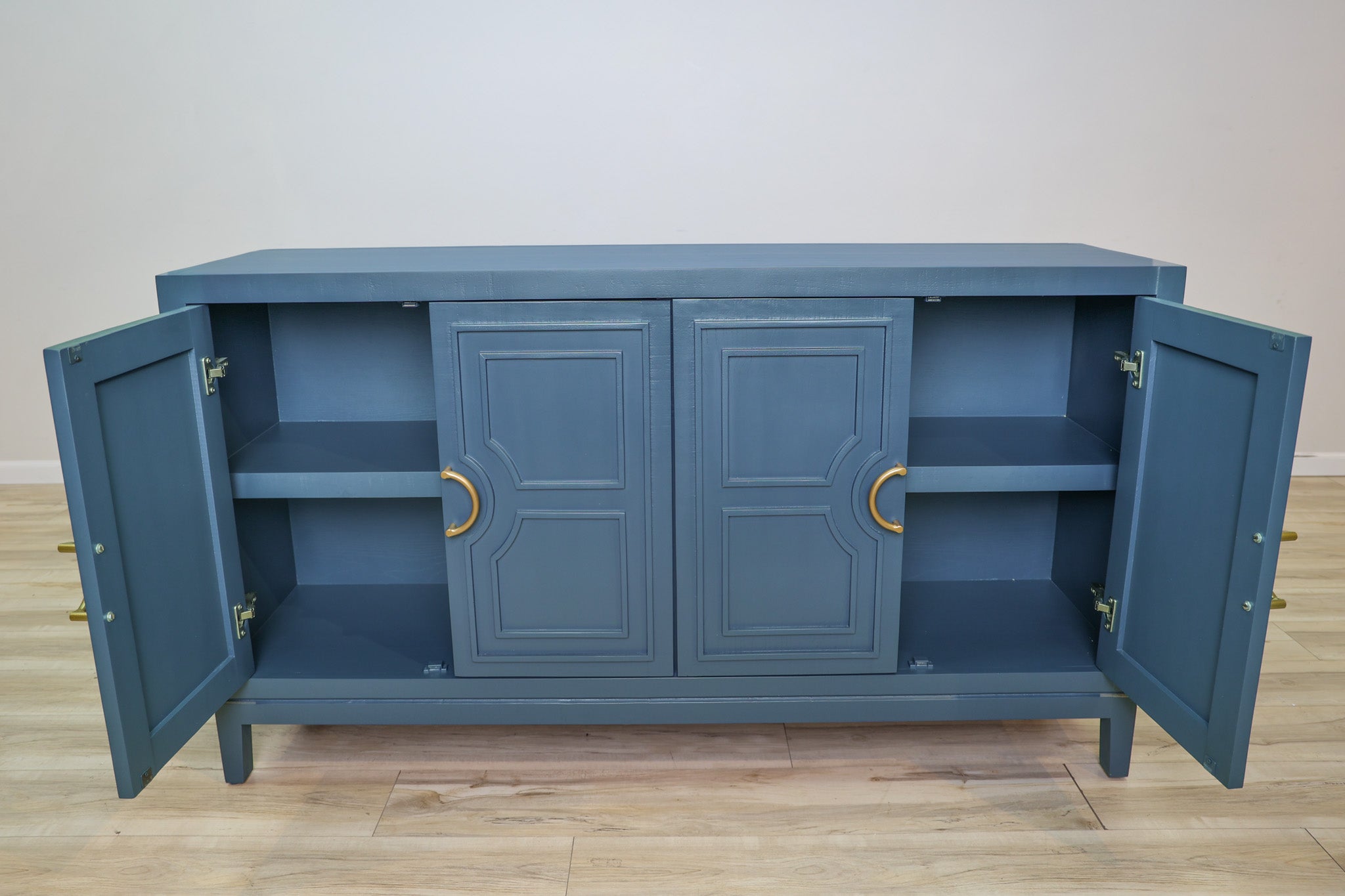 David 64-inch blue credenza in solid Mexican pine with four geometric panel doors and gold ring pulls, living room