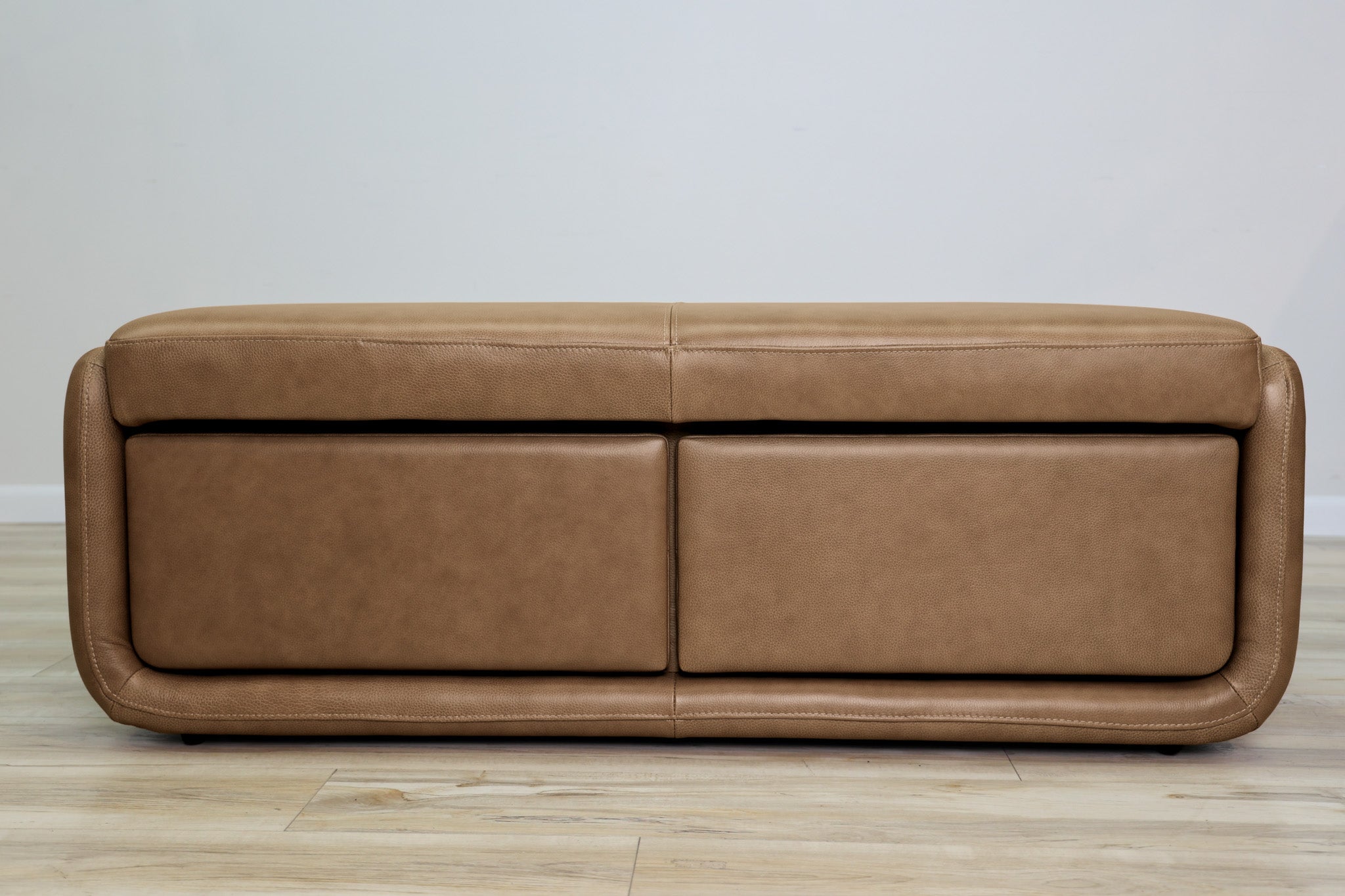 Gomez storage bench in brown top-grain leather with two pull-out drawers and a cushioned top, living room