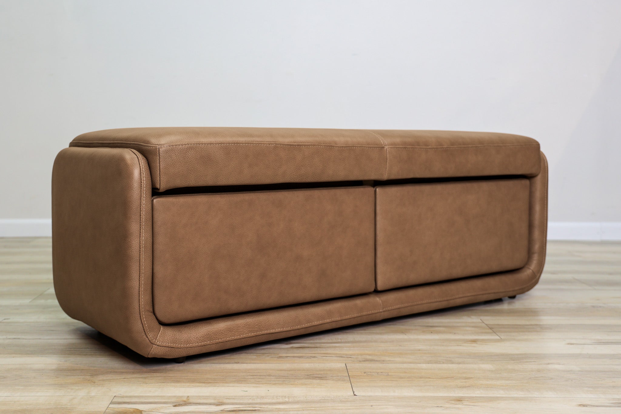 Gomez storage bench in brown top-grain leather with two pull-out drawers and a cushioned top, living room