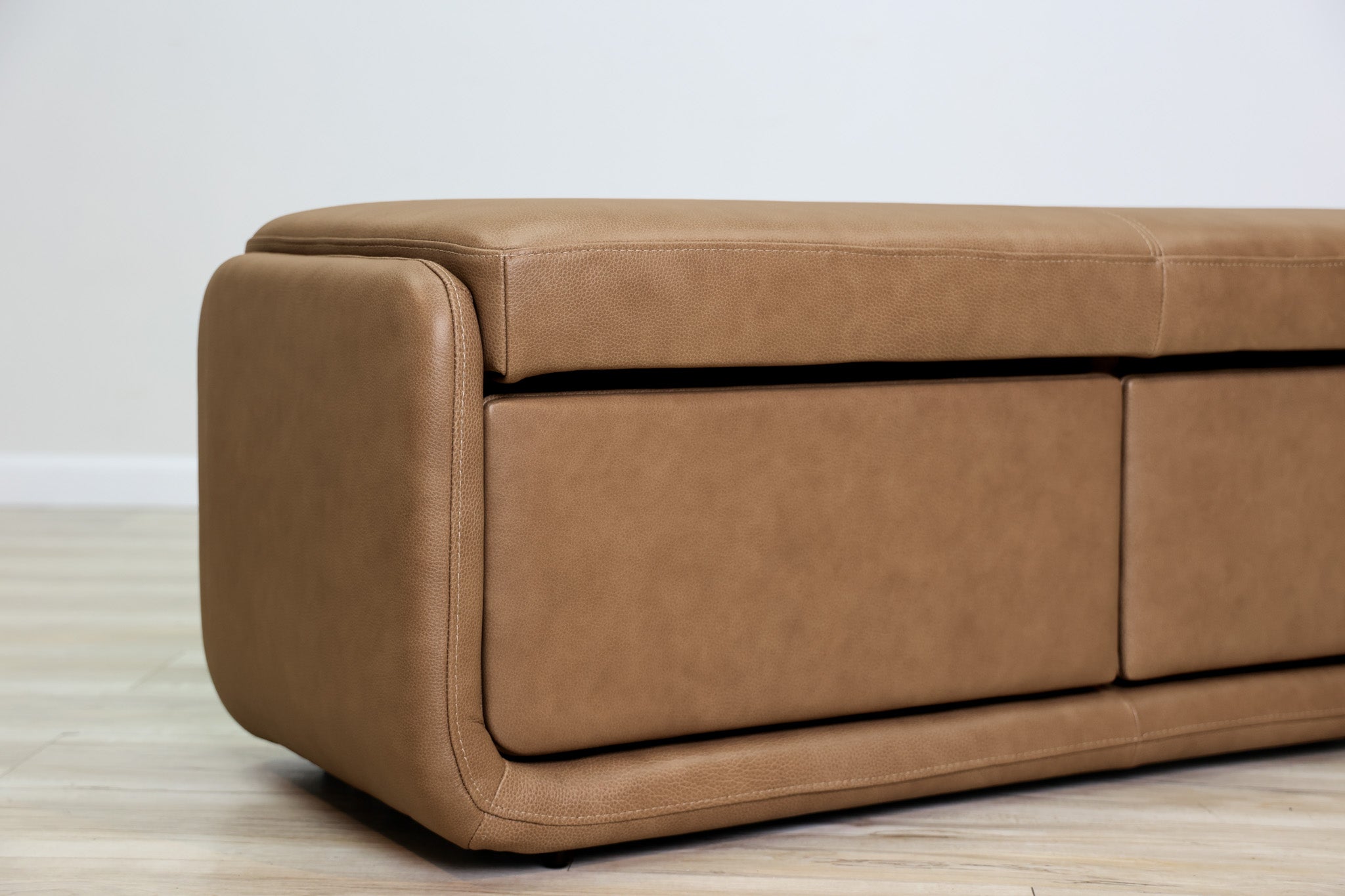 Gomez storage bench in brown top-grain leather with two pull-out drawers and a cushioned top, living room