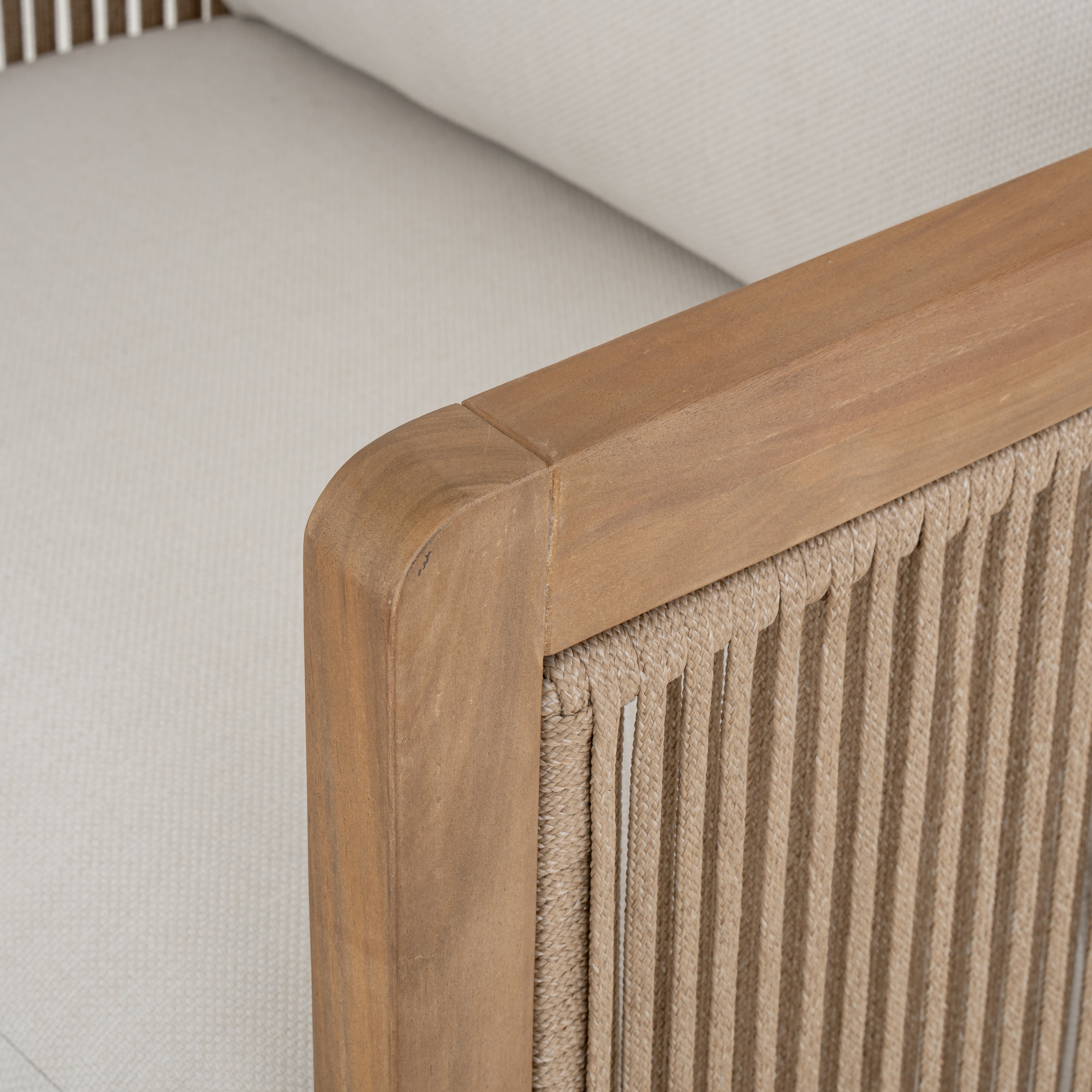 Napa outdoor accent chair with a natural wood frame, woven rope detailing, and ivory all-weather cushions, patio