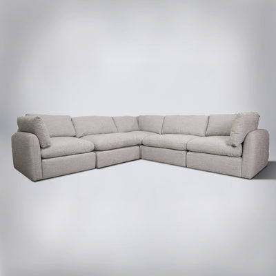 The Bristol Cloud Sectional, a sandy beige-gray performance-fabric cloud sectional