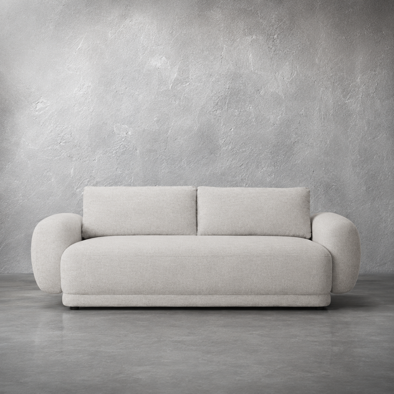 white sofa against a gray concrete wall