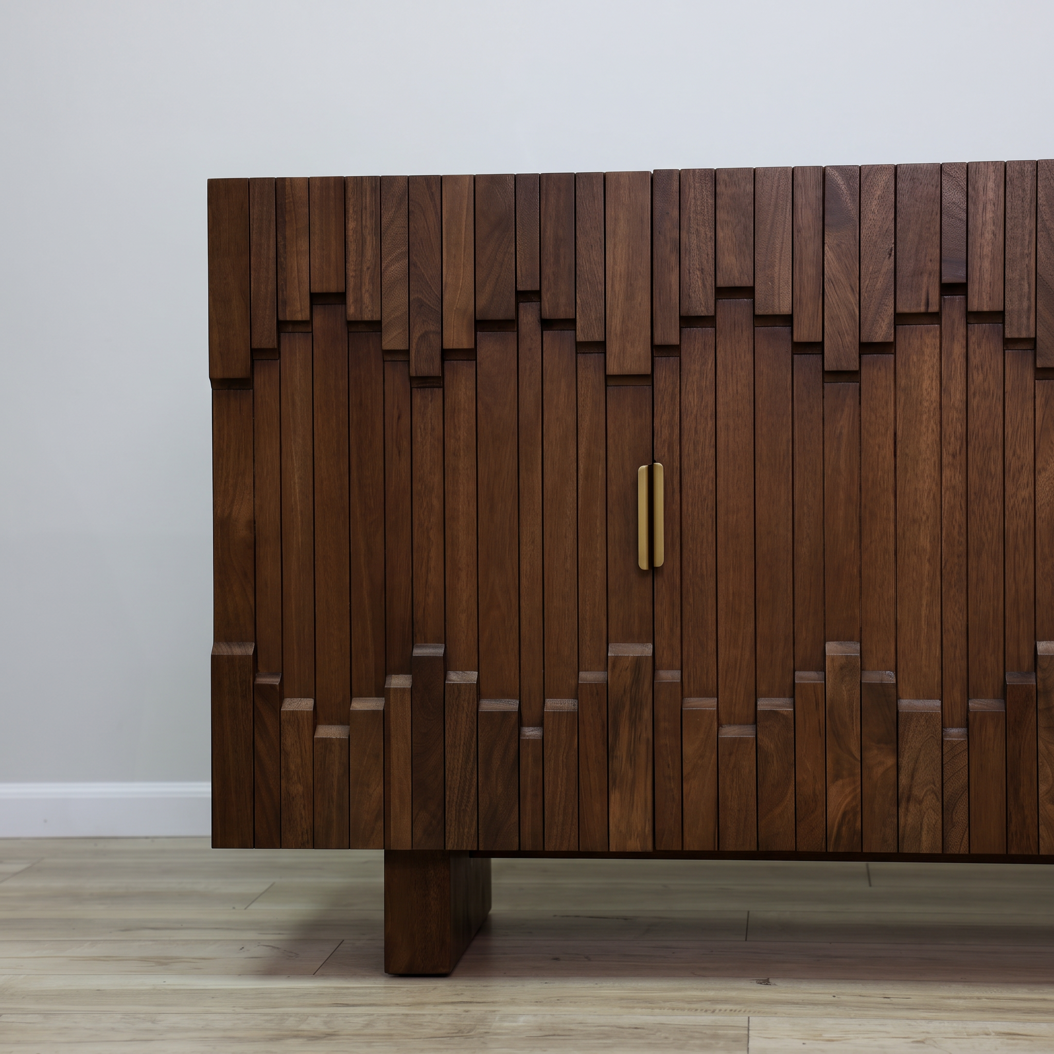 Mary credenza in solid mango wood with a sculptural block-relief front, gold bar pulls, and block feet, living room