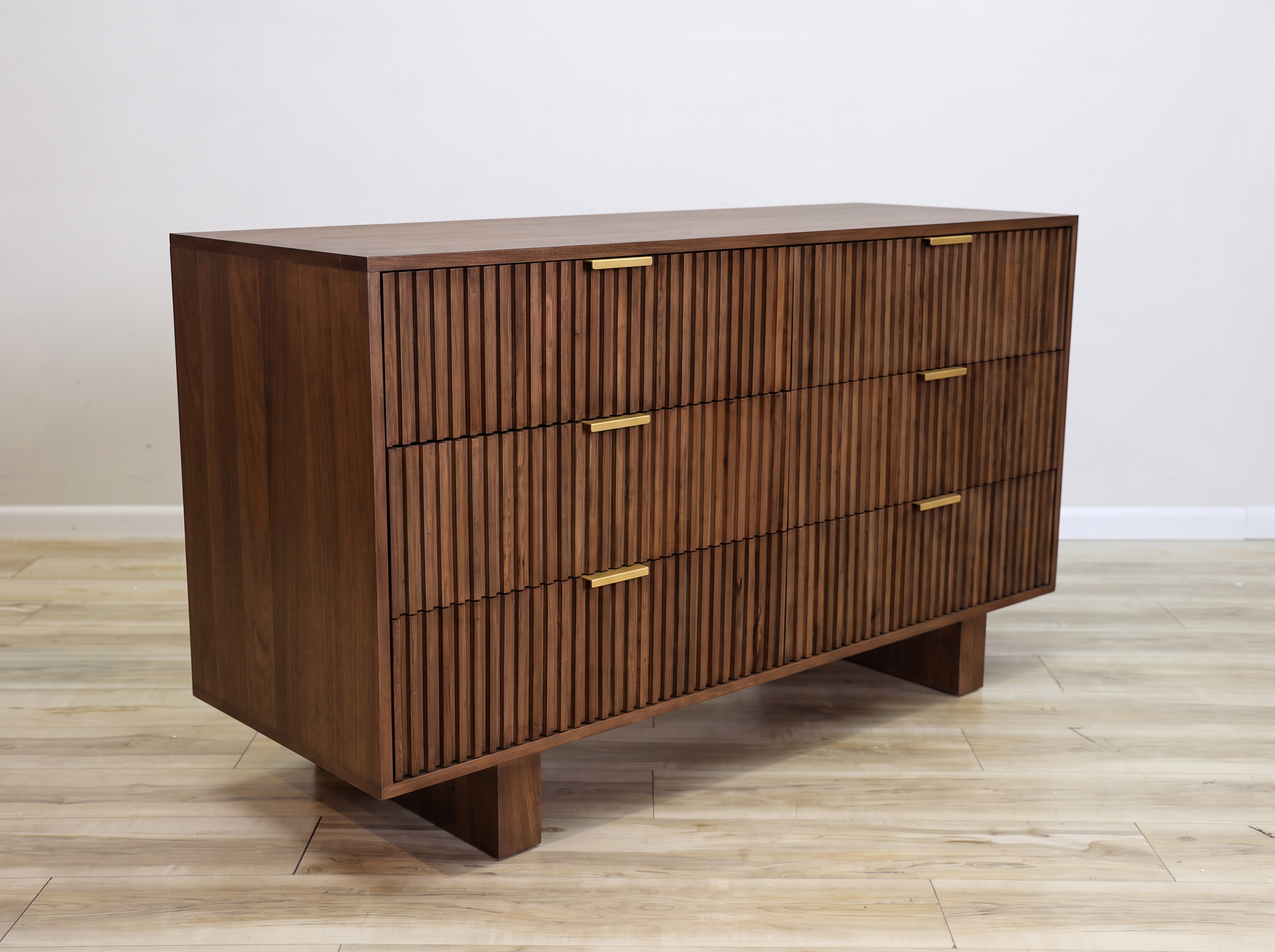 Mocha dresser in solid mango wood with six fluted drawer fronts, gold bar pulls, and two solid block feet, bedroom