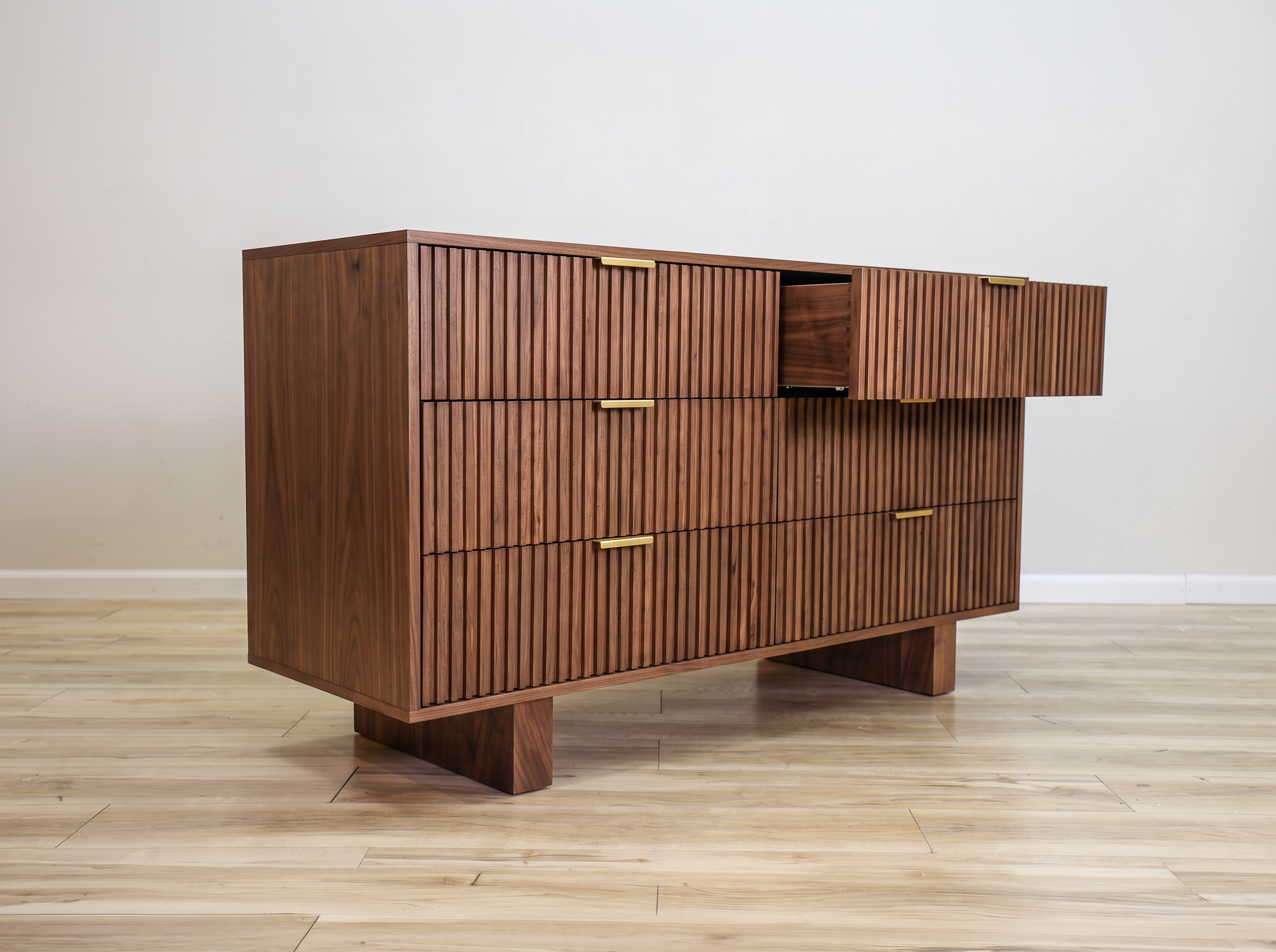 Mocha dresser in solid mango wood with six fluted drawer fronts, gold bar pulls, and two solid block feet, bedroom
