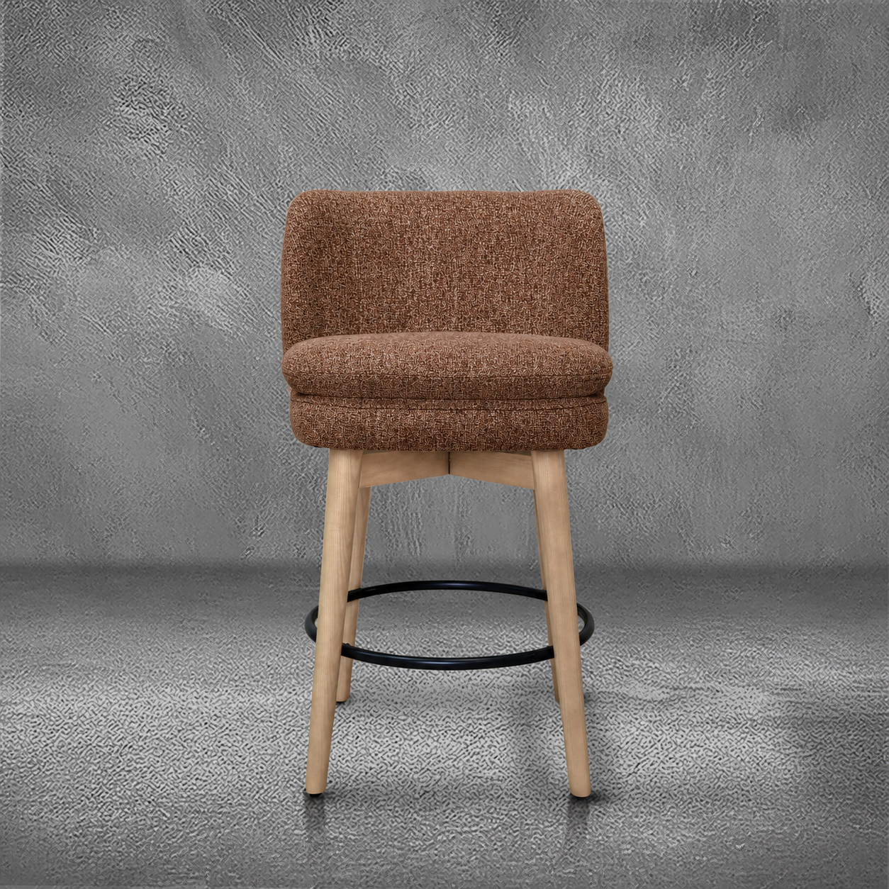 Elmer counter stool in rust performance fabric with a low wraparound back, natural wood legs, and a black ring footrest, kitchen counter