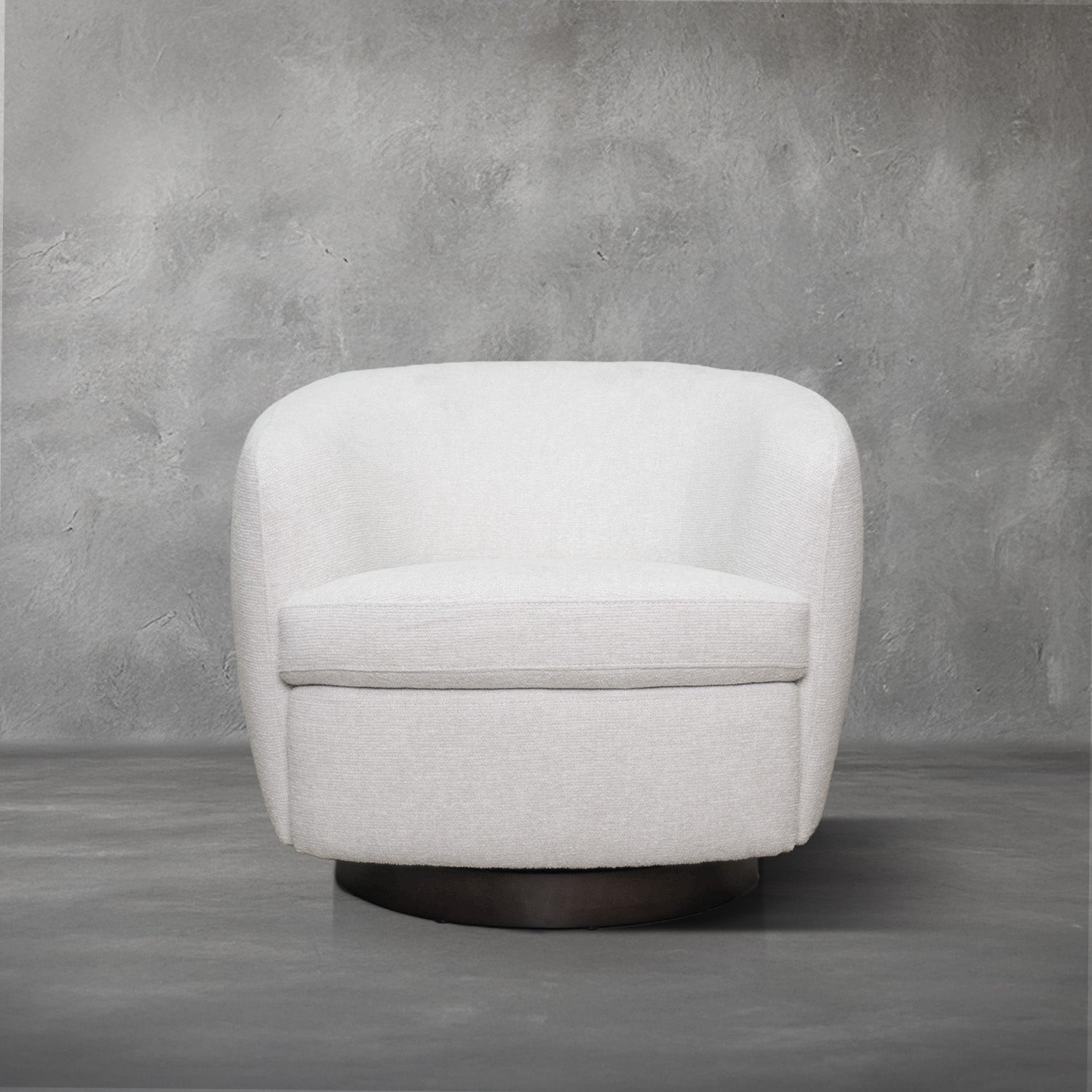 London Swivel Chair in white performance fabric with a curved barrel body on a dark wood swivel base, living room
