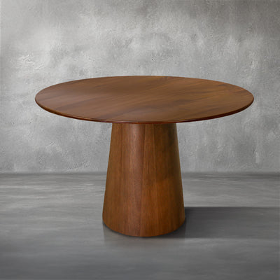 Nova 48-inch round dining table in warm mango wood on a clean pedestal base