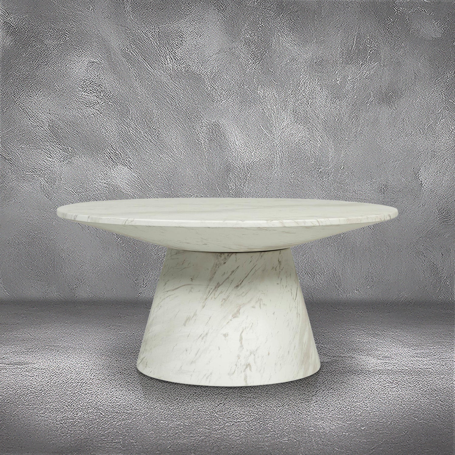 Pasadena Indoor/Outdoor Coffee Table, a round pedestal coffee table in white marble-look glass-fibre reinforced concrete with soft gray veining