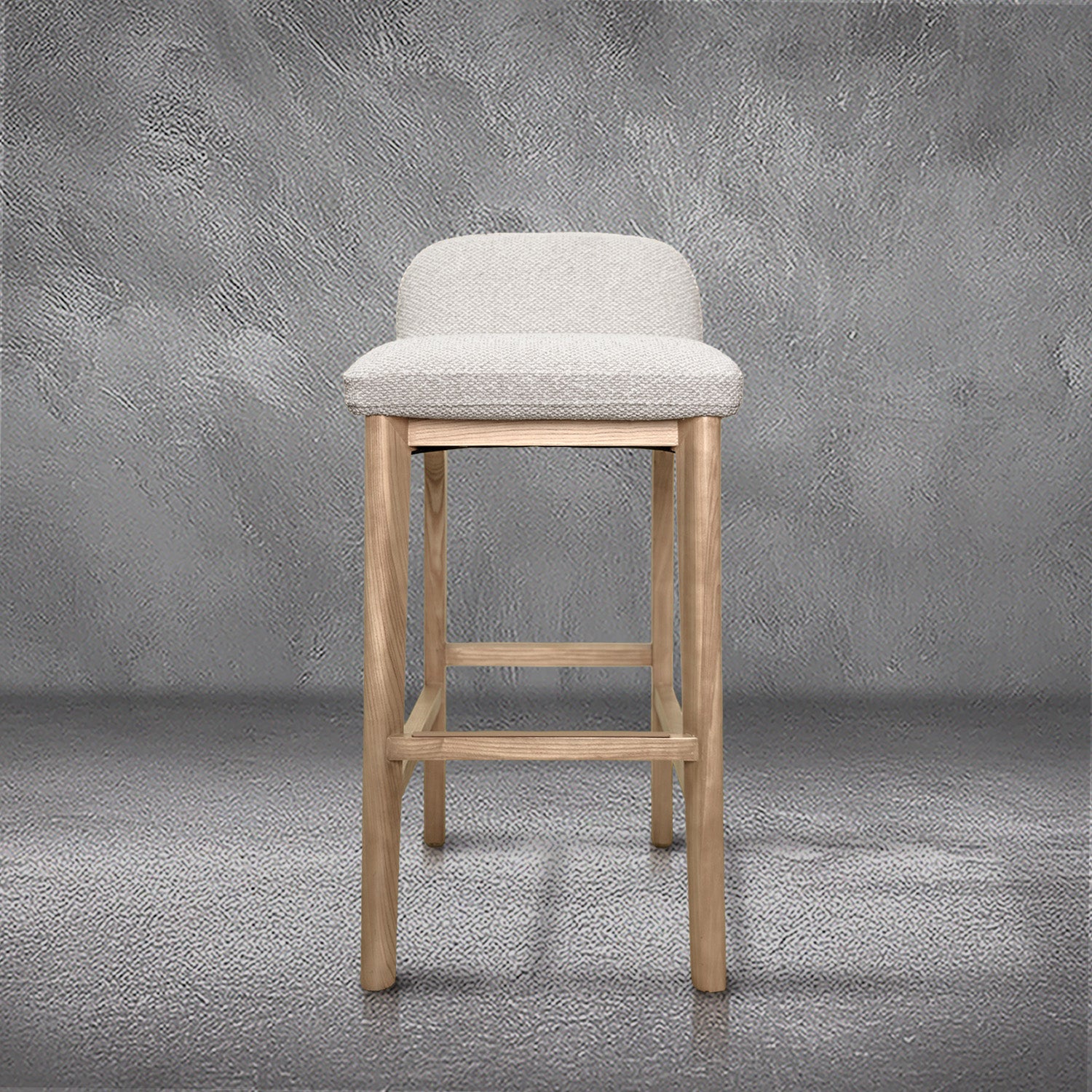Asher barstool in beige performance fabric with a low back and natural wood legs with stretchers, kitchen bar