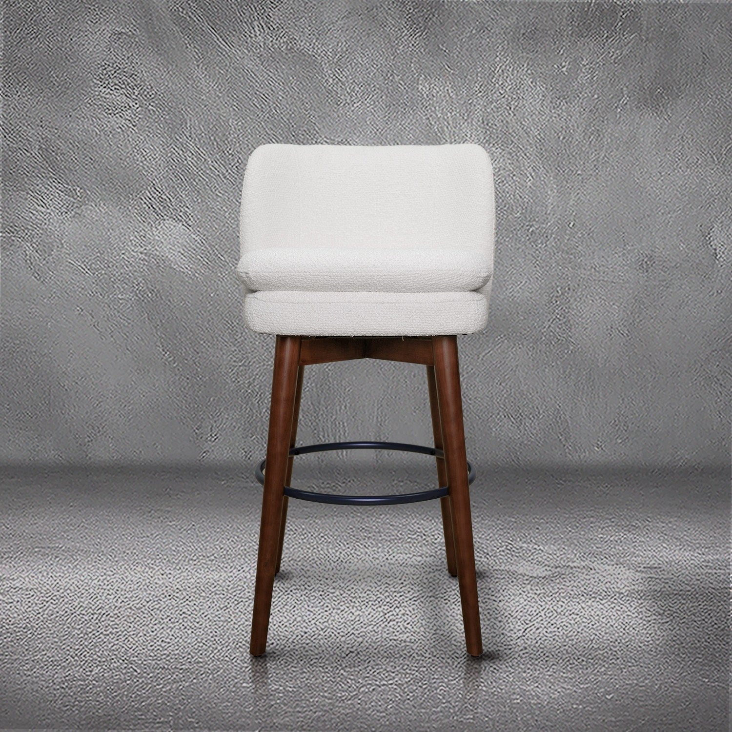 Avalon swivel barstool in cream bouclé performance fabric with walnut wood legs and a black ring footrest, kitchen bar