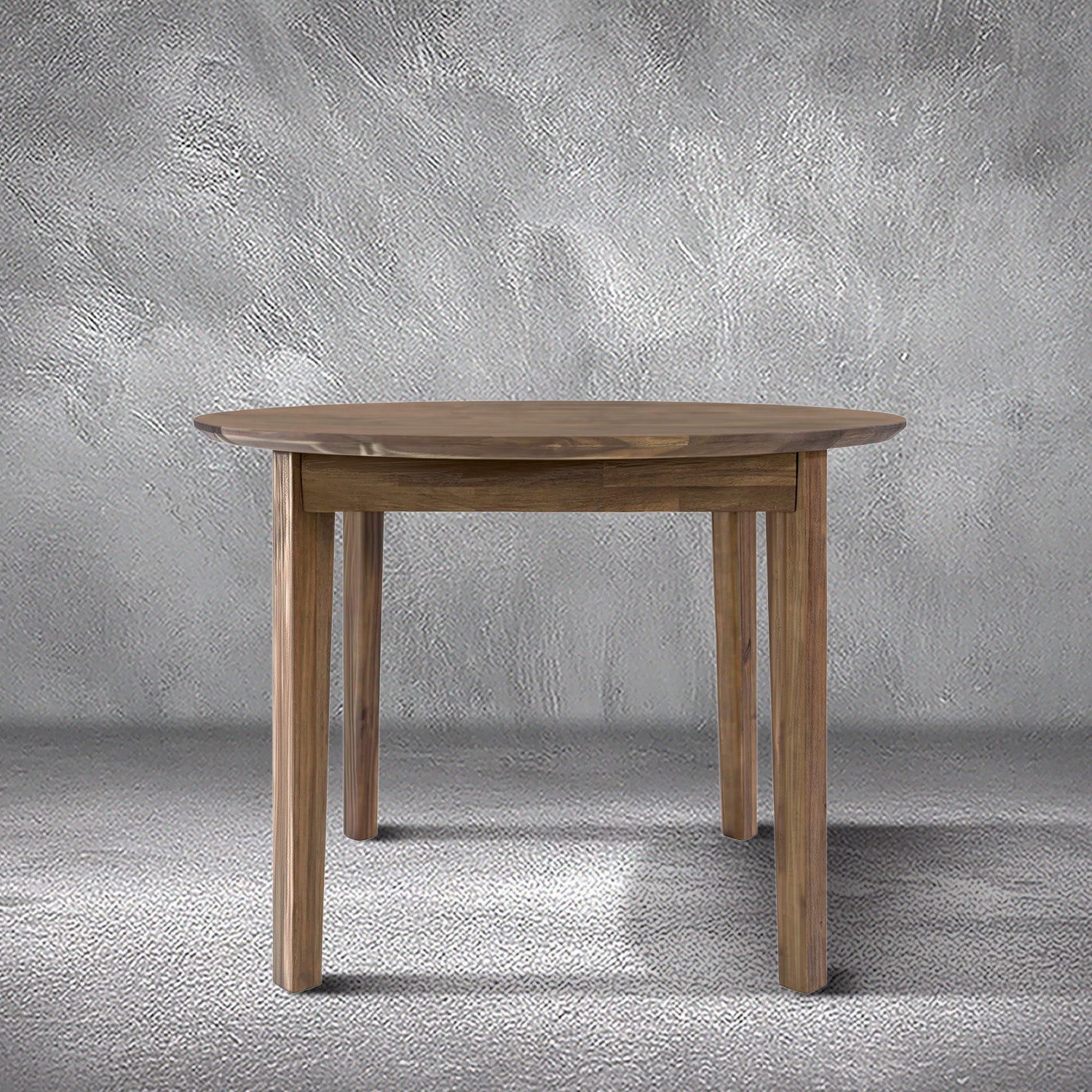 Brad round dining table in warm acacia wood with a round top and tapered legs, dining room
