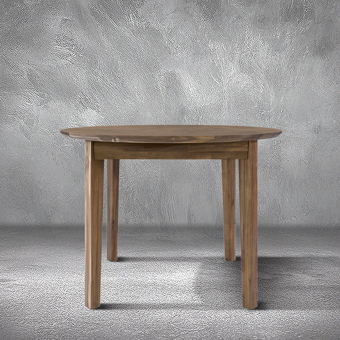 Brad round dining table in warm acacia wood with a round top and tapered legs, dining room