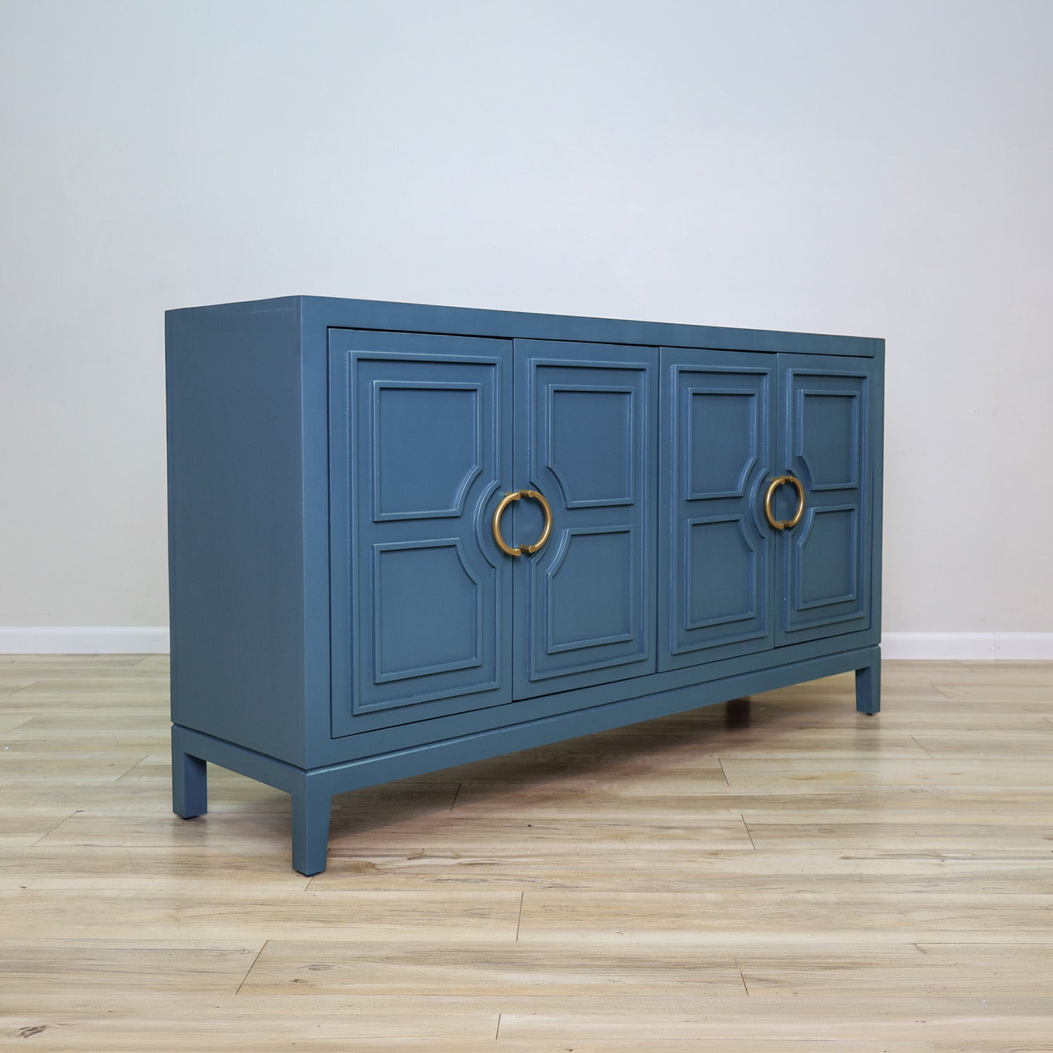David 64-inch blue credenza in solid Mexican pine with four geometric panel doors and gold ring pulls, living room