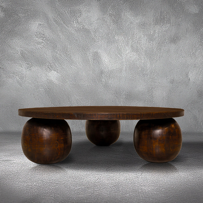 Fernandez round coffee table in solid Mexican pine with three spherical wood ball feet, living room