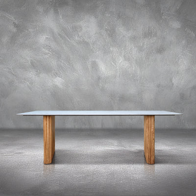 Fitzgerald rectangular dining table with a marble top on two fluted natural mango wood legs