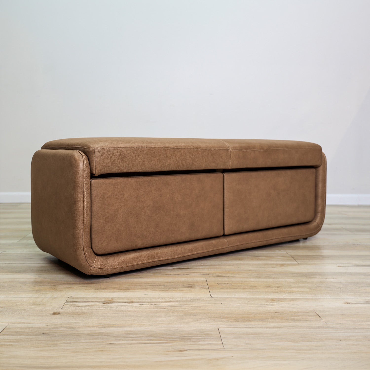 Gomez storage bench in brown top-grain leather with two pull-out drawers and a cushioned top, living room