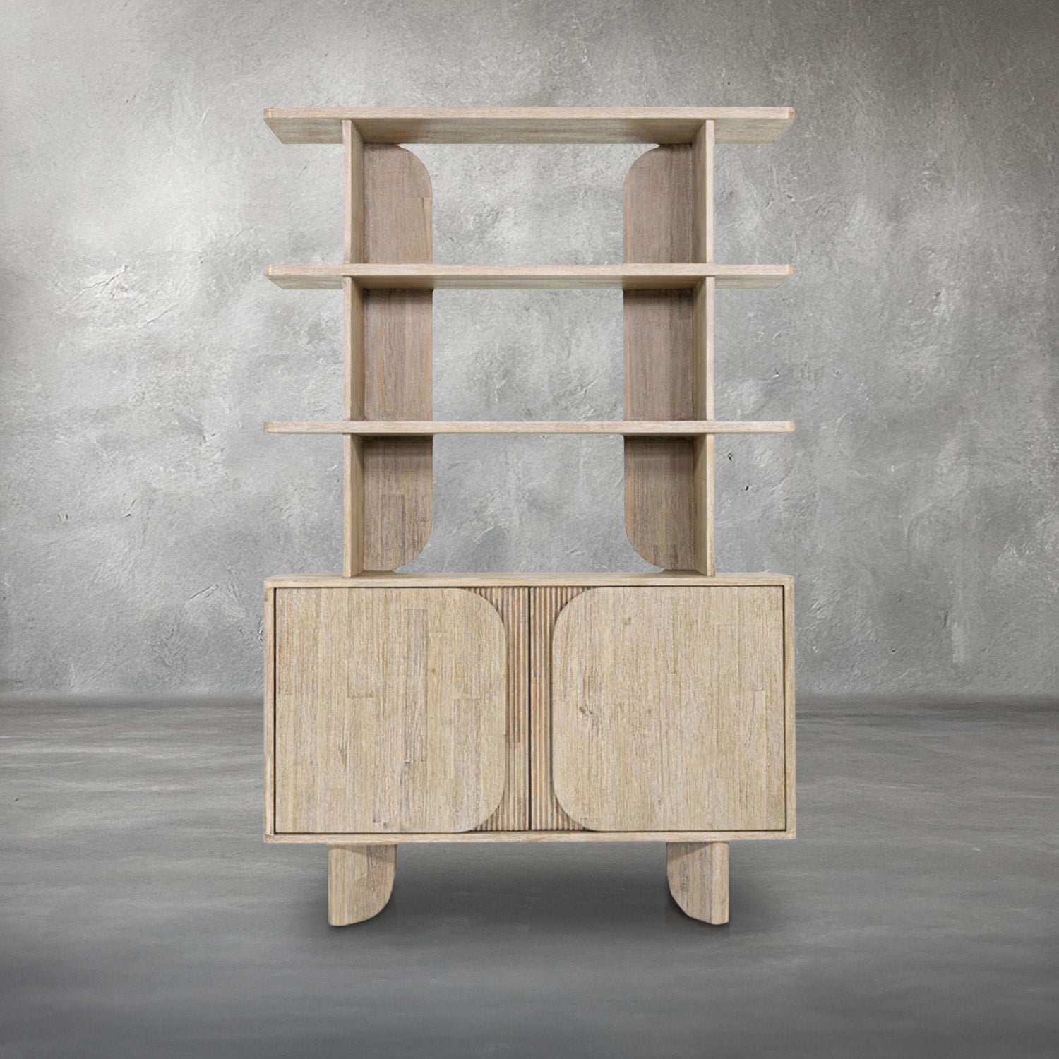 Harlow Bookshelf, a tall acacia wood etagere with three open display shelves on curved supports above a two-door cabinet with reeded panels and curved feet, in a soft brushed natural finish