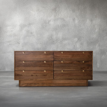 Harper Dresser in walnut mango wood with six clean drawers and gold half-moon pulls, in a bedroom