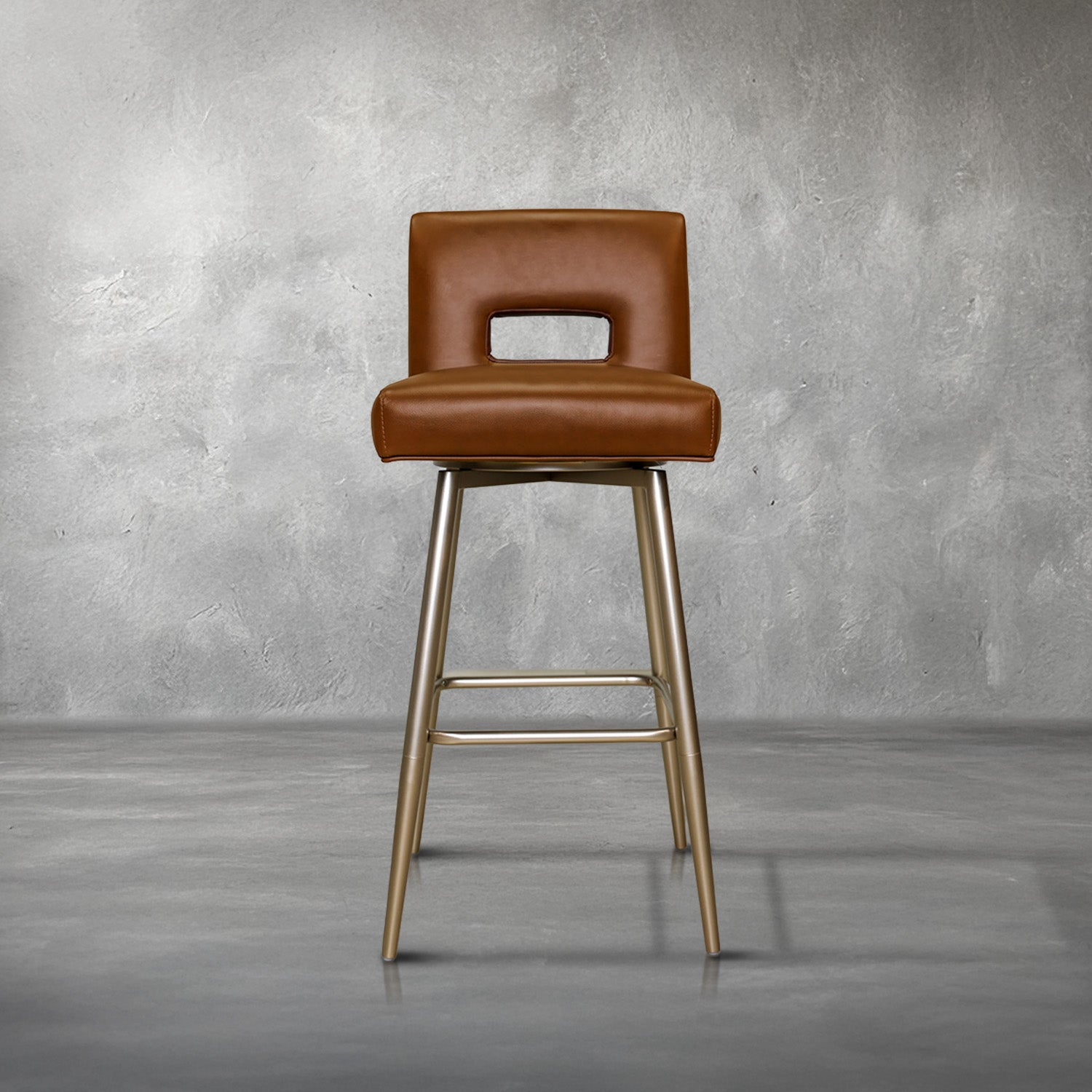 Versa Keyback adjustable barstool in cognac faux leather with a keyhole back and gold metal swivel base, kitchen bar