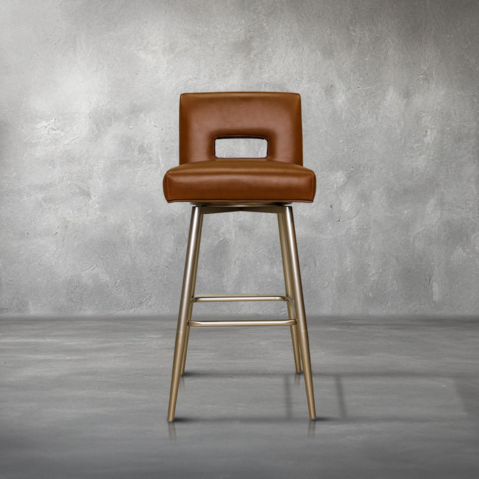Versa Keyback adjustable barstool in cognac faux leather with a keyhole back and gold metal swivel base, kitchen bar