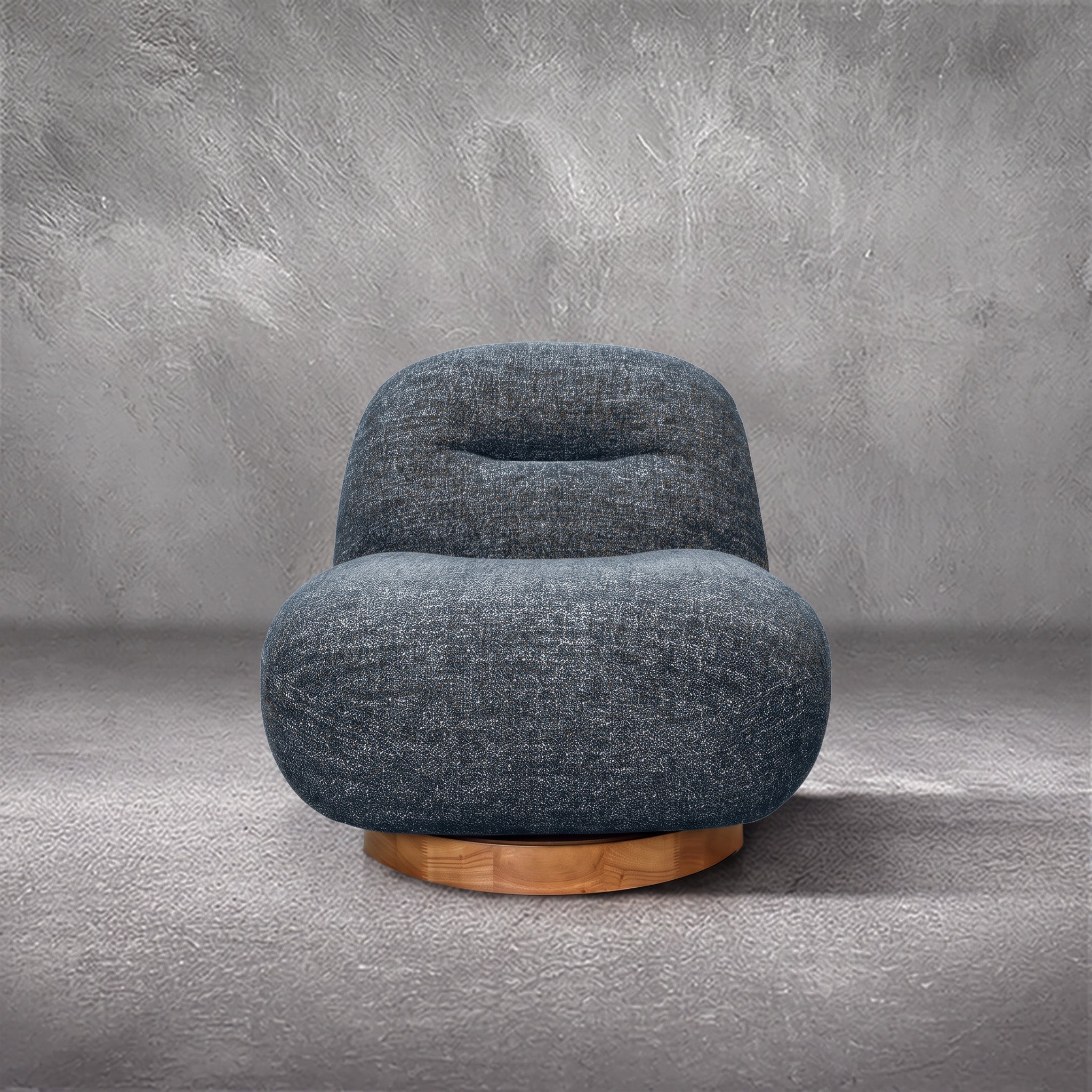 Holmes Beach swivel accent chair in textured blue performance fabric with caramel fibers on a round wood swivel base, living room