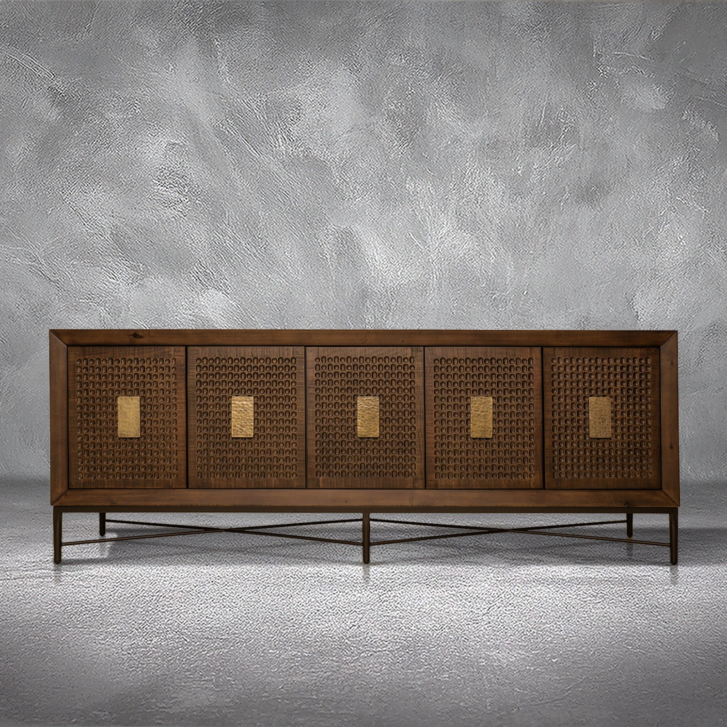 Jonathan credenza in solid Mexican pine with five carved dimpled doors, gold plate pulls, and a metal base, living room
