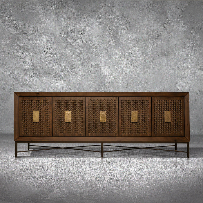 Jonathan credenza in solid Mexican pine with five carved dimpled doors, gold plate pulls, and a metal base, living room