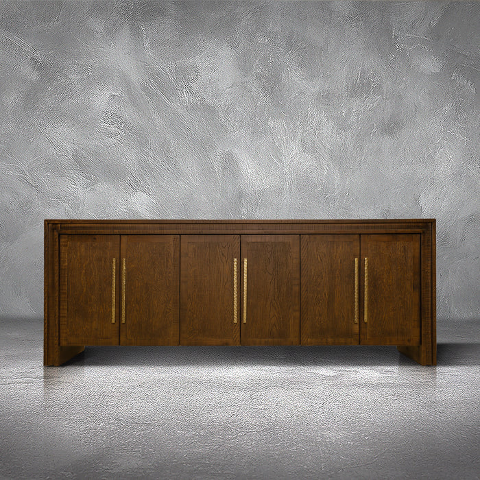 Manny 97-inch credenza in solid Mexican pine with six doors and hammered gold bar handles, living room