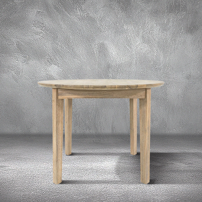 Reunion round dining table in light acacia wood with a round top and tapered legs, dining room