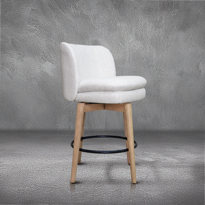 Tiffany swivel counter stool in ivory Crypton fabric with natural wood legs and a black ring footrest, kitchen counter