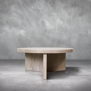 Trinity Large Coffee Table, round bleached oak top on a cross-shaped panel base, living room