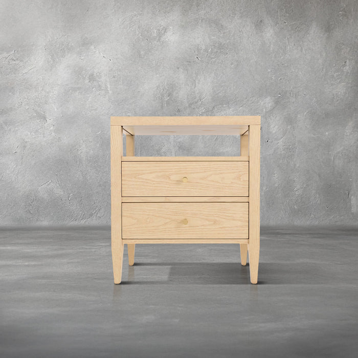 Willow nightstand in light natural wood with an open shelf over two drawers, gold knob pulls, and tapered legs, bedroom