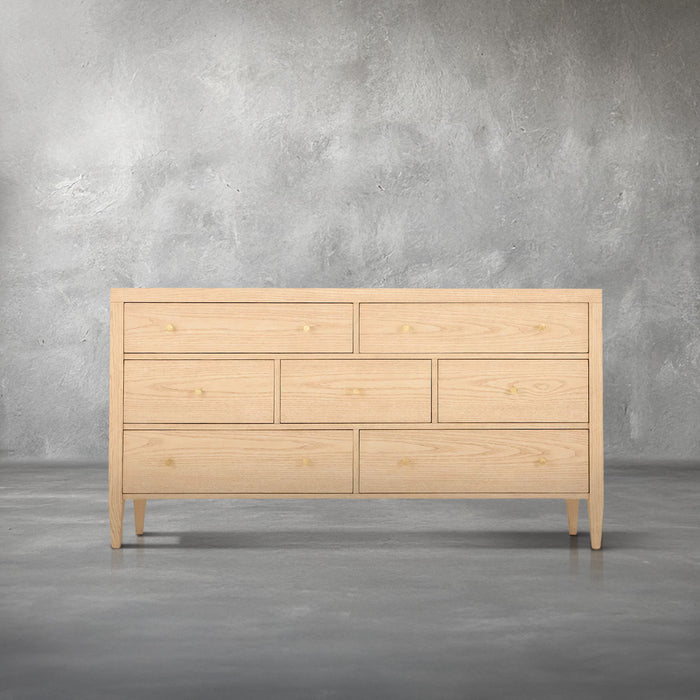 Willow dresser in light natural wood with seven drawers, gold knob pulls, and tapered legs, bedroom